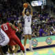 JaKobe Coles (21) tries his luck from beyond the arc.